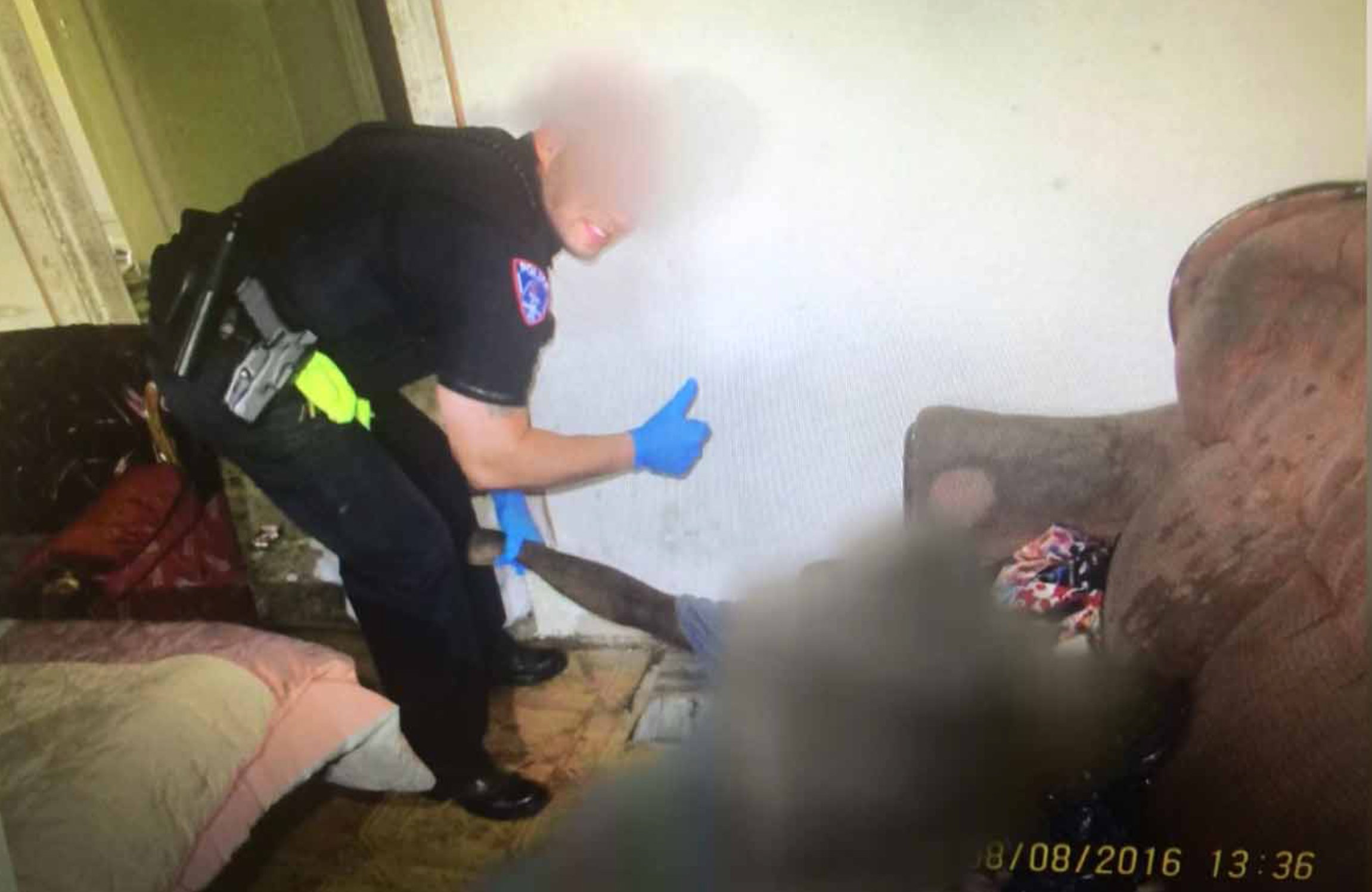 Photo Surfaces Of White Cop Giving 'Thumbs Up' Next To Black Man's Dead Body 
